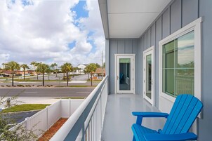 Premium bedding, desk, laptop workspace, blackout drapes