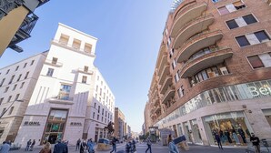 A busy urban street with modern buildings, including a prominent BNL bank and a Bershka store. - MEDINA ART & LIFESTYLE NAPOLI CENTRO by ClaPa Group Dislocated Hospitality (Naples)