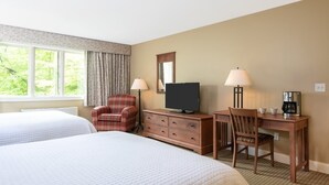 A hotel room with two beds, a TV, a desk with a chair, and a coffee maker. - Ski-In Resort Room | 2 Queen Beds (West Dover)