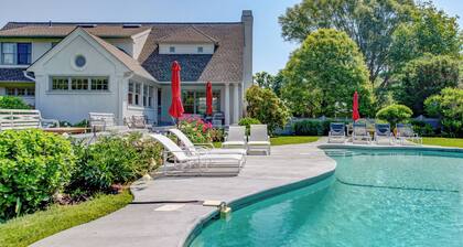 Traditional-style home with private pool, sweeping back deck, grand lawn,...