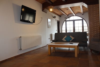 Quiet house on the outskirts of the city surrounded by pine forests and hills.