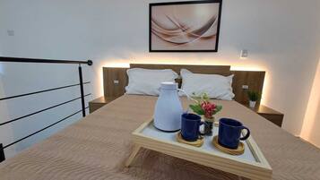 Deluxe Studio, Microwave, City View | 1 bedroom, blackout drapes, iron/ironing board, free WiFi