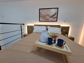 Deluxe Studio, Microwave, City View | Blackout drapes, iron/ironing board, free WiFi, bed sheets