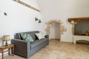 Deluxe-Vierbettzimmer | Wohnbereich