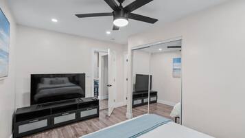 1 bedroom, desk, iron/ironing board, travel crib