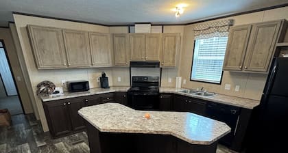 Charming 3-bedroom mobile home in a peaceful country setting.