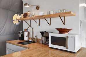 Fridge, microwave, cookware/dishes/utensils, paper towels