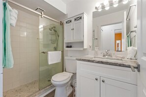 Shower, hair dryer, towels, soap