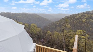 A tented area with a view of a valley and forested hills. - Hot Tub Dome with Epic Ridge Views- Hickory Heights (Stanton)