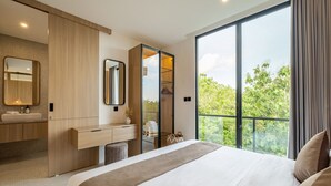A modern bedroom with a large bed, a vanity with a mirror, and a wardrobe. - Tropical Private Pool Villa 8C, 10min - Melasti Beach (Pecatu)