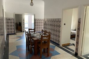 Enjoy meals in this dining area with a table for four and comfortable seating.