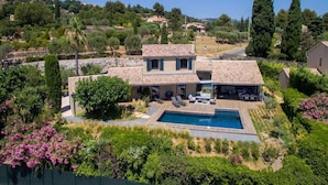 A two-story house with a swimming pool, surrounded by lush greenery and hills in the background. - Exceptional air-conditioned house, swimming pool in Ollioules, Var, near Sanary-sur-Mer. (OLLIOULES)
