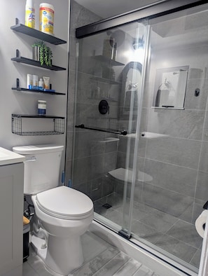 Shower, hair dryer, towels, soap