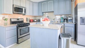 A modern kitchen with grey cabinets, stainless steel appliances, and a granite countertop. - Sunnyvale 3B2b Super Big House (Sunnyvale)