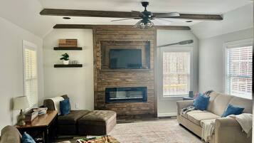 Smart TV, fireplace, books