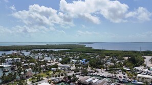 A coastal town with a marina, houses, and a beach. - Nice Water Front Tiny home w AC, WiFi include boat ramp & 20ft dock in KeyLargo (Key Largo)