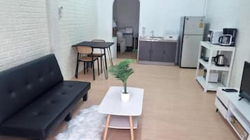 Comfort Townhome, Kitchenette, City View | Living area | Flat-screen TV