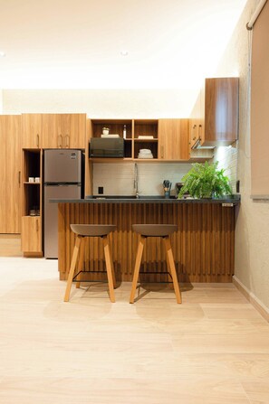 Fridge, microwave, stovetop, coffee/tea maker