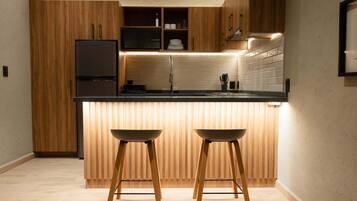 Fridge, microwave, stovetop, coffee/tea maker