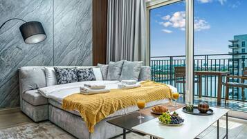 Signature Apartment, Balcony, Canal View | Living area | 63-inch Smart TV with digital channels, Netflix, streaming services