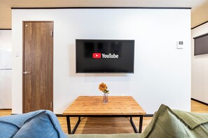Casa conforto | Área de estar | TV de tela plana 50 polegadas com canais a cabo