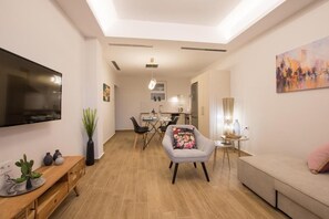 Superior Apartment, Partial Sea View | Living area