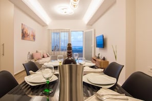 Appartement Supérieur, vue partielle sur la mer | Coin séjour