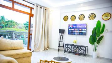 Comfort Apartment | Living area | 32-inch Smart TV with digital channels