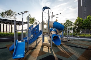 A playground with slides and climbing structures.