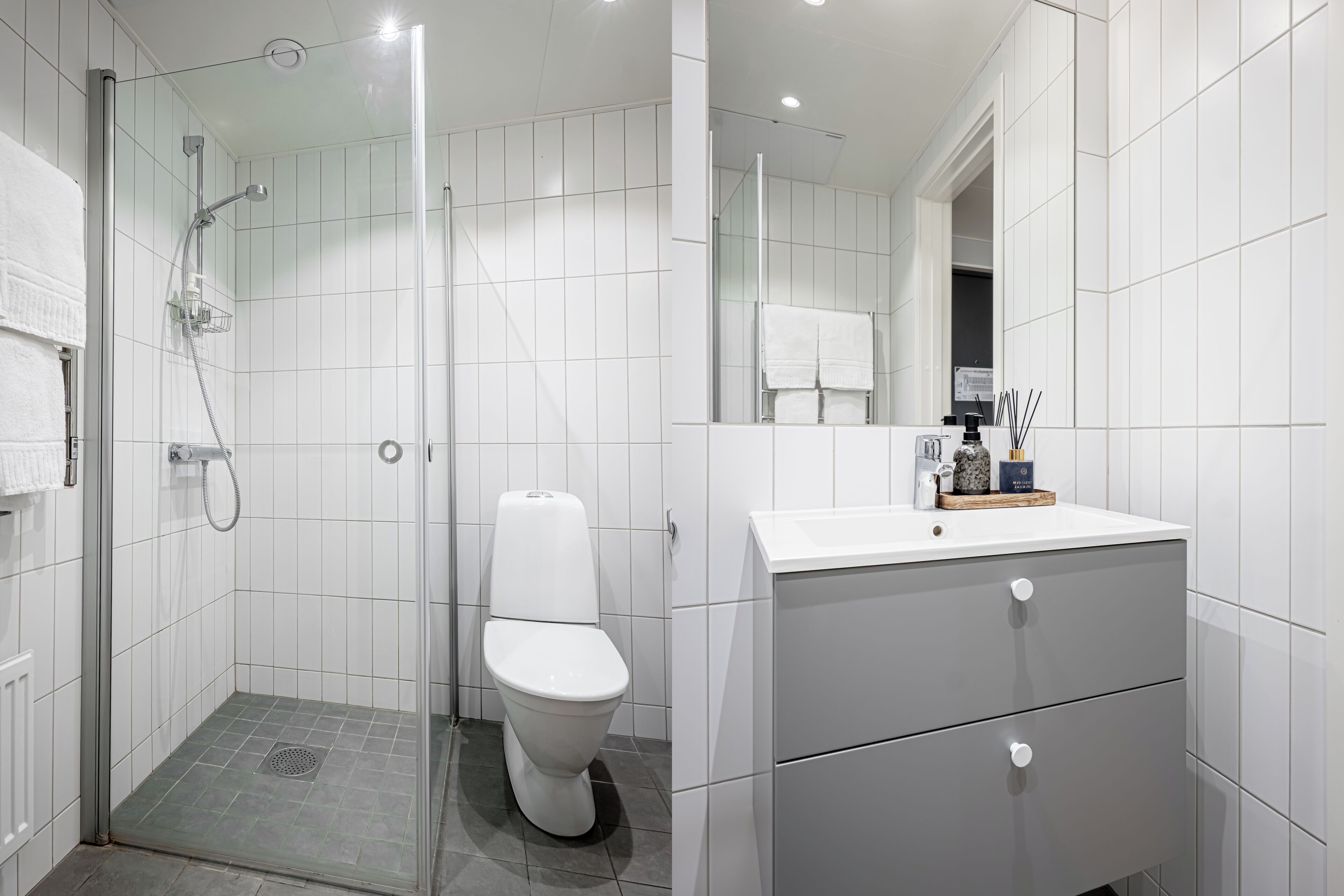 Un baño moderno con ducha, inodoro y tocador.