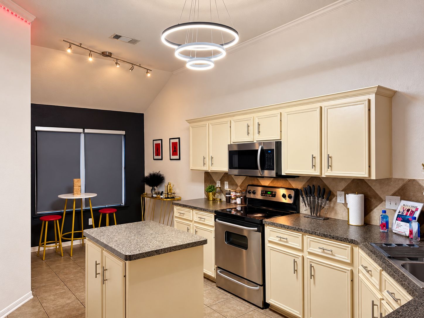 Fully equipped kitchen and bar seating for intimate meals.