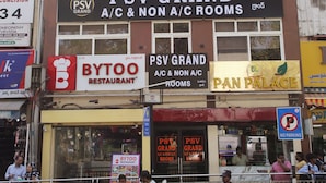 A multi-story building with signage for PSV GRAND offering A/C and non A/C rooms. - PSV Grand (Hyderabad)