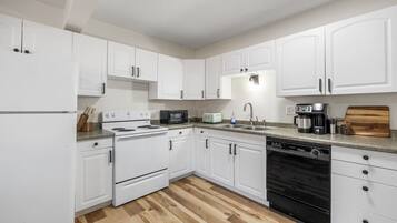 Fridge, microwave, stovetop, coffee/tea maker