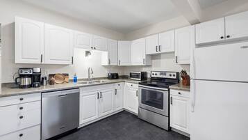 Fridge, microwave, stovetop, coffee/tea maker