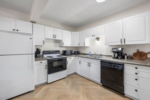 Fridge, microwave, stovetop, coffee/tea maker