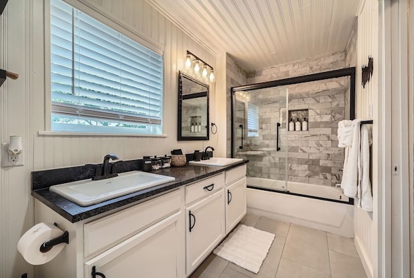 Shower, hair dryer, towels, shampoo