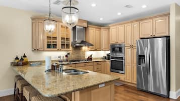 House, Multiple Beds, Patio, Garden View (448 Beach Bike Way) | Private kitchen | Fridge, microwave, oven, stovetop