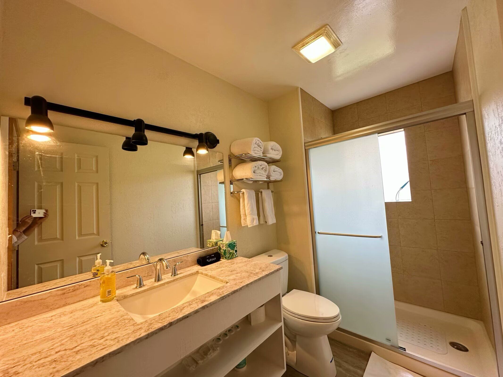 Shower, hair dryer, towels, shampoo