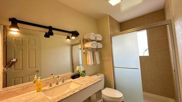 Shower, hair dryer, towels, shampoo