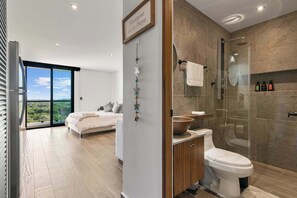Shower, hair dryer, towels, shampoo