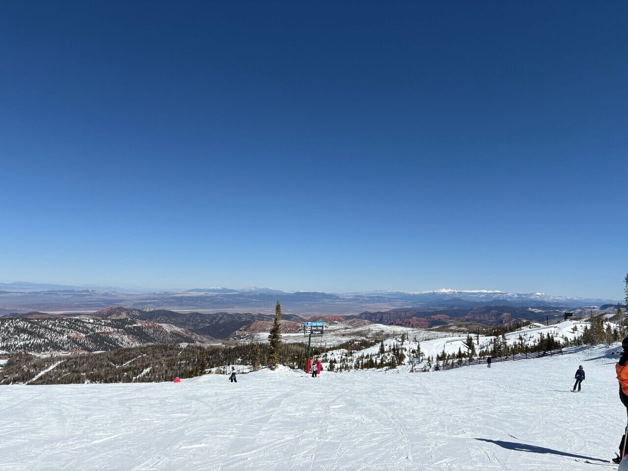 A snowy mountain landscape with a clear sky.