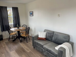 Suite, Kitchen, Partial Ocean View | In-room dining - Buoy & Arrow Restaurant and Suites (Rocky Harbour)