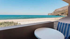 A balcony with a view of a beach and the sea. - Creta Beachfront Apartment B for 2 persons by MPS (Paralia Fodele)