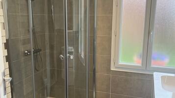 Shower, hair dryer, towels, soap