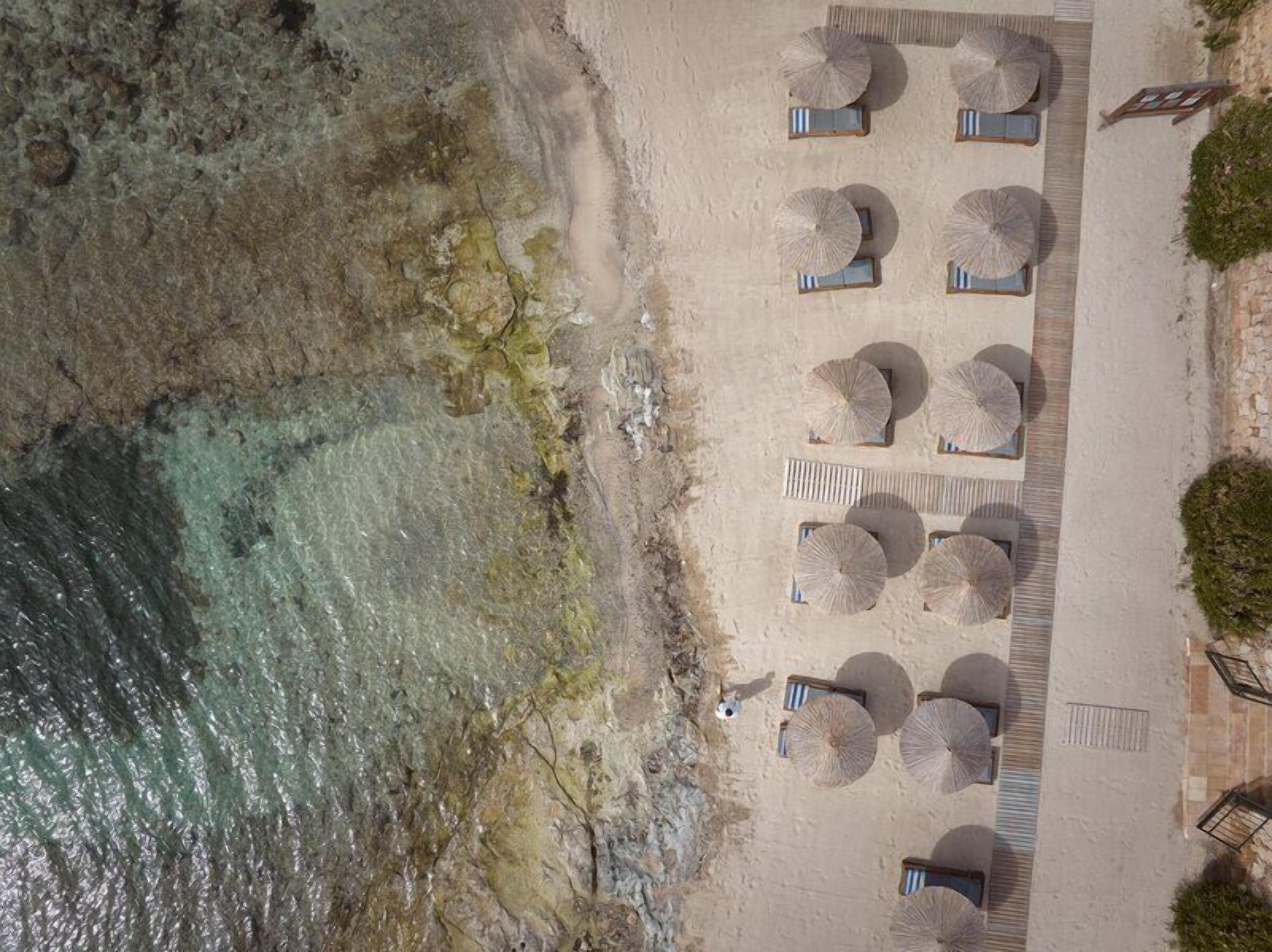 On the beach, sun loungers, beach umbrellas, beach towels