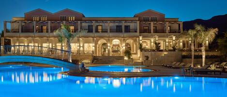 Seasonal outdoor pool, open 10:00 AM to 6:00 PM, pool umbrellas