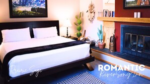 A bedroom with a bed, a fireplace, a wall-mounted TV, and a framed picture. - Priaire Sage Room at RiverSong Inn in Estes Park - Riverside in Rocky Mountain National Park (Estes Park)