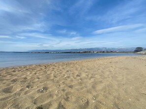 On the beach, sun-loungers