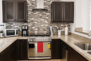 Premium Villa, Partial Ocean View | Private kitchen | Coffee/tea maker, highchair, dining tables - Family Home Private Garden and Jacuzzi (Cabo San Lucas)