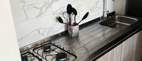 Fridge, microwave, stovetop, coffee/tea maker